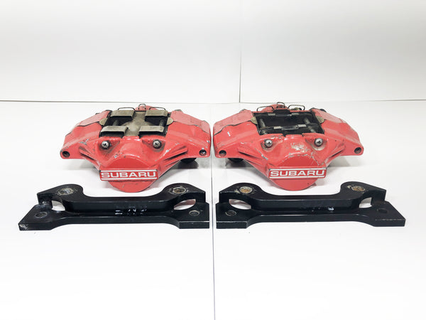 JDM Subaru Impreza WRX Rear 2 Pot Brake Calipers Mounting Bracket 1993-2007 OEM | Calipers | 2 pot, 2005, Forester, Impreza, Red Brake Calipers, STI, Subaru, WRX, wrx 2004, wrx 2005, WRX STI | 1440